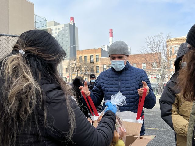 Miguel Rodriguez of Elmhurst picks up free groceries at a food pantry run by Hour Children in Long Island City, February 22nd, 2022